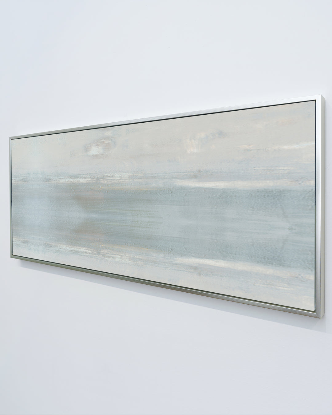 A side view of Anonymity by Carol Benson-Cobb, a horizontal framed canvas showcasing abstract layers of soft neutral tones for a modern, serene living space.