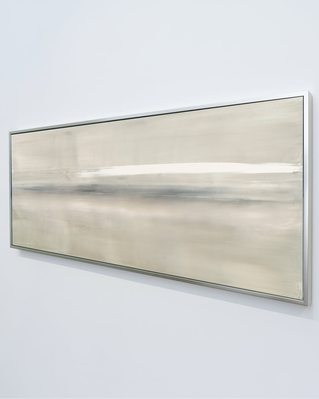 A side vieew of At Dusk by Carol Benson-Cobb, a framed horizontal canvas with layered blue, gray, and cream tones, ideal for modern and sophisticated decor